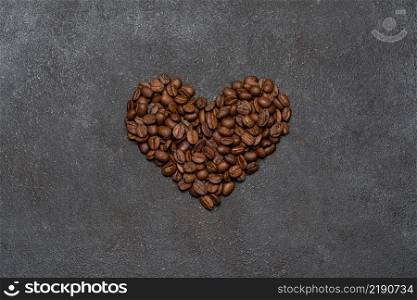 Background or wallpapper - heart made of coffee beans on grey congrete. Background or wallpapper - heart made of coffee beans on congrete
