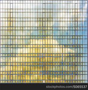 Background photo. Reflection of the sky in the steel tiles panel