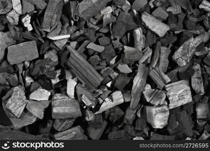 Background texture made of lumps of black charcoal