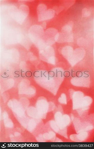 Background texture of blurry and grainy hearts.