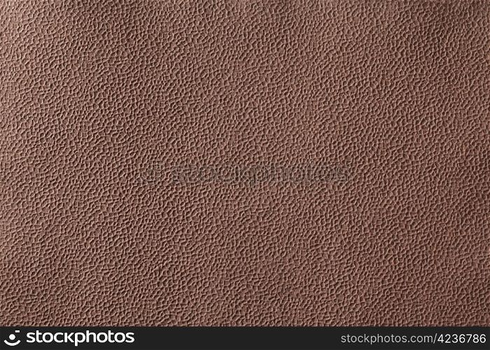 Background texture of brown bumpy handmade paper.