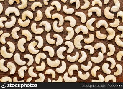 background texture of cashew nuts on a rustic grunge wood