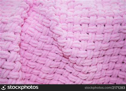 Background texture of plush fabric in pink color, background pattern of soft woolen material, cozy concept. Place for an inscription. Background texture of plush fabric in pink color, background pattern of soft woolen material, cozy concept. Place for an inscription.