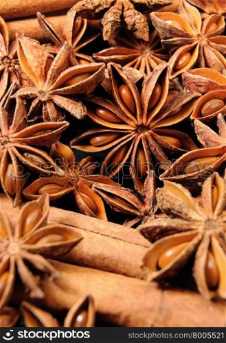 Background texture of several star anise fruits and seeds