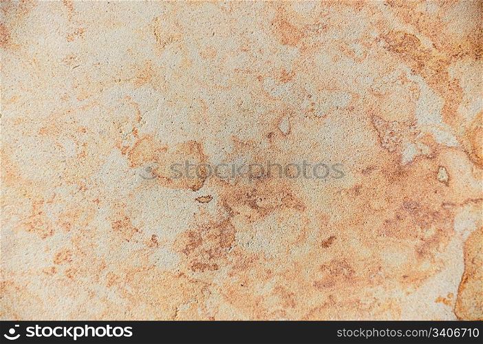Background - texture of stone, a beautiful abstract pattern in beige and golden tones