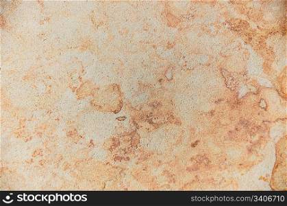 Background - texture of stone, a beautiful abstract pattern in beige and golden tones