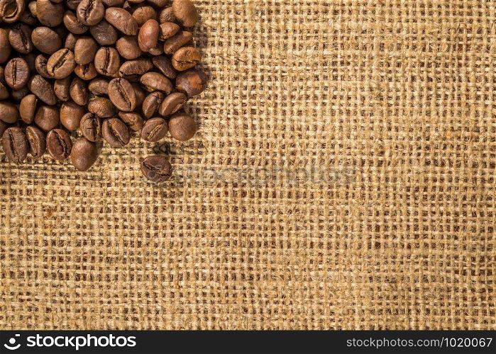 Background with coffee beans and burlap texture
