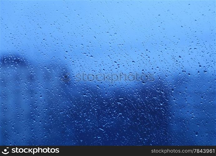 Background with natural water drops on glass