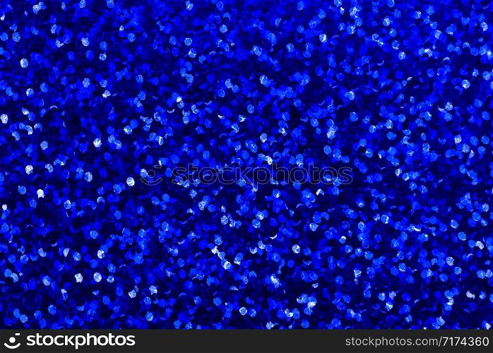 Background with navy blue sequin texture. Glitter background for Holiday and party banner. Abstract glitter poster with blinking lights. Fabric sequins in bright colors.. Background with navy blue sequin texture. Glitter background for Holiday and party banner.