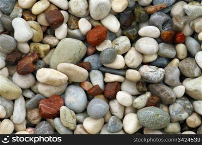 background with sea wet pebble stones