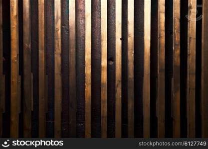 Background wooden wall with gold paint closeup
