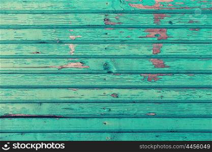 backgrounds and texture concept - old wooden fence painted in blue. old wooden boards painted in blue background