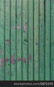 backgrounds and texture concept - old wooden fence painted in green background. old wooden boards painted in green background
