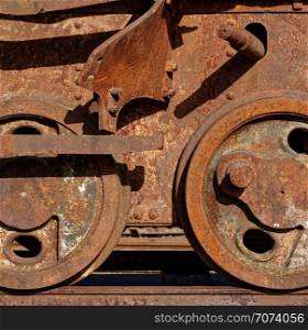 Backgrounds and textures: abandoned railway car wheels, broken and rusty. Abandoned railway car