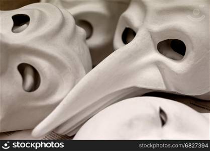 Backgrounds and textures: big group of unfinished traditional Venice masks, plain white paper