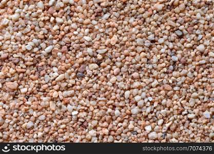 Backgrounds and textures: coarse sand surface, close-up shot. Coarse sand surface