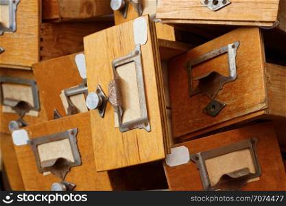 Backgrounds and textures: disorderly group of very old wooden drawers. Disorderly group of old wooden drawers