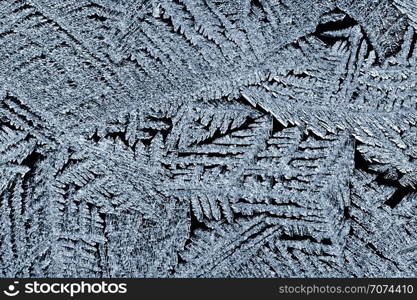 Backgrounds and textures: frost pattern on a window glass. Frost pattern