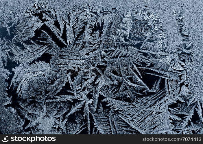 Backgrounds and textures: frost pattern on a window glass. Frost pattern