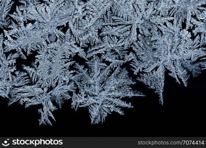 Backgrounds and textures: frost pattern on a window glass. Frost pattern
