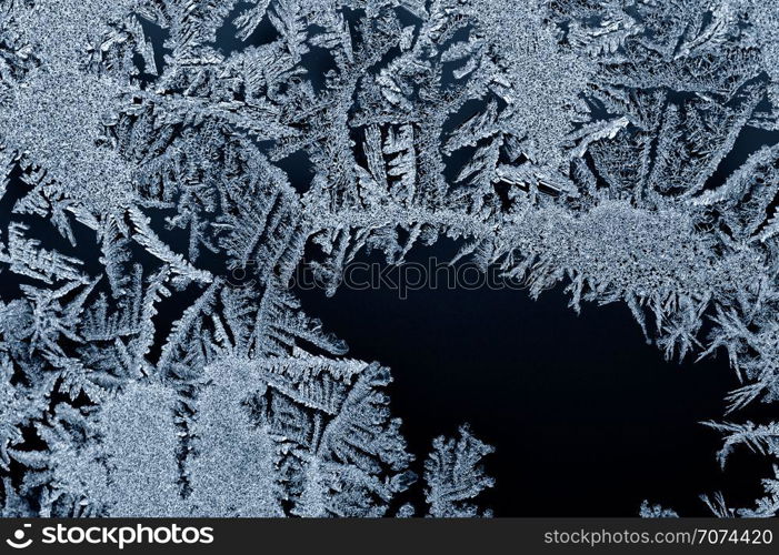 Backgrounds and textures: frost pattern on a window glass. Frost pattern