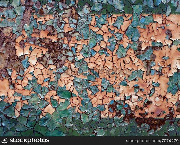Backgrounds and textures: layers of old cracked paint on rusty metal surface. Old cracked paint