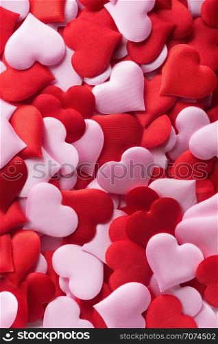 Backgrounds and textures: mix of red and pink hearts, suitable for Valentine`s day or wedding or some else romantic event. Mix of red and pink hearts