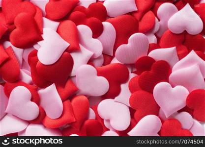 Backgrounds and textures: mix of red and pink hearts, suitable for Valentine`s day or wedding or some else romantic event. Mix of red and pink hearts