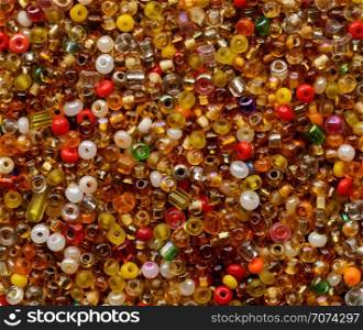 Backgrounds and textures: multicolor beads assortment, abstract background. Multicolor beads assortment