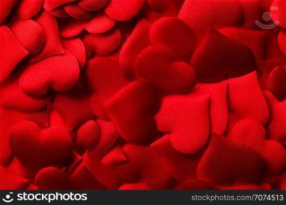 Backgrounds and textures: red hearts background, suitable for Valentine`s day or wedding or some else romantic event. Red hearts background