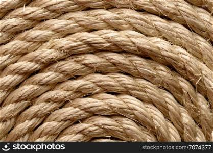 Backgrounds and textures: sisal rope arranged as background, close-up shot. Sisal rope
