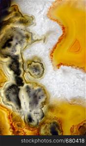 Backgrounds and textures: surface of agate or chalcedony slab, beautiful decorative stone, abstract pattern of cracks, spots and stains, natural background. Agate abstract mineral texture