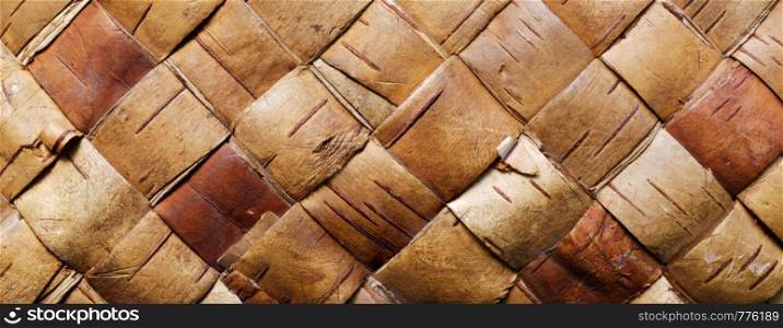 Backgrounds and textures: traditional handmade container detail, wattled pattern made of birch bark. Wattled pattern made of birch bark