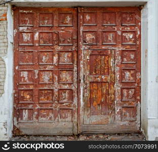 Backgrounds and textures: very old gateway, closed doors, aged cracky paint. Very old gateway