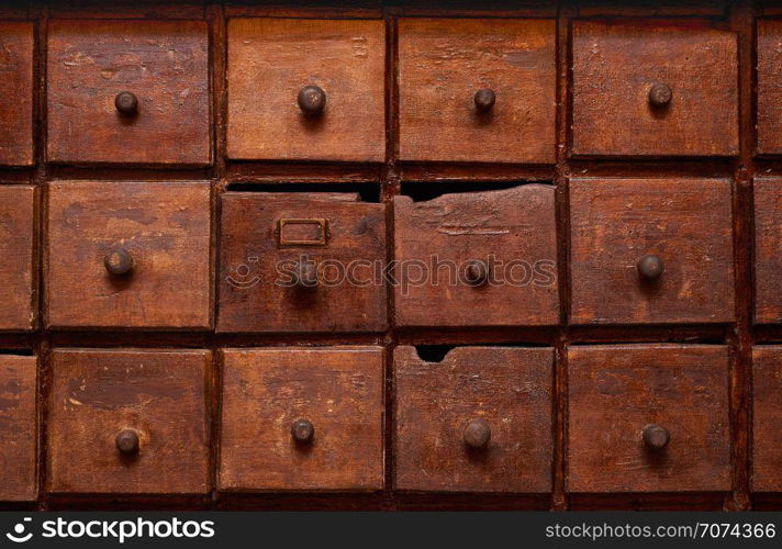 Backgrounds and textures: very old wooden cabinet with drawers. Wooden cabinet with drawers