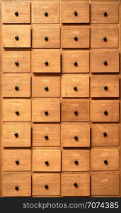 Backgrounds and textures: very old wooden cabinet with drawers. Wooden cabinet with drawers