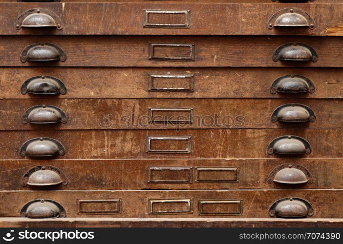 Backgrounds and textures: very old wooden cabinet with drawers. Wooden cabinet with drawers