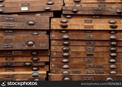 Backgrounds and textures: very old wooden cabinet with drawers. Wooden cabinet with drawers