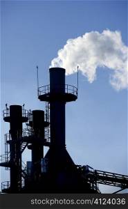 Backlight petrochemical industry smog smoke on sky