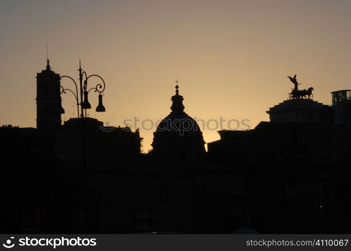 Backlit rooftop silhouettes in Rome, Italy