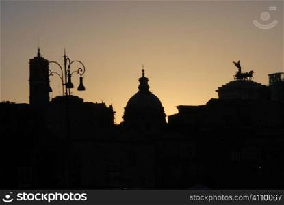 Backlit rooftop silhouettes in Rome, Italy