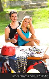 Backpack active young couple relax with climbing gear sunny terrace