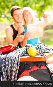 Backpack healthy young couple relax with climbing gear sunny terrace