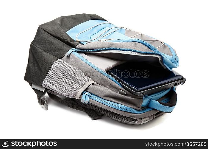 Backpack with a laptop inside isolated on white background