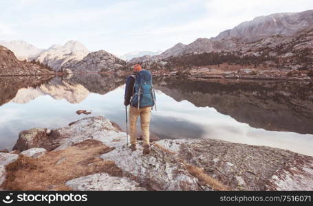 Backpacker in a hike in the summer mountains