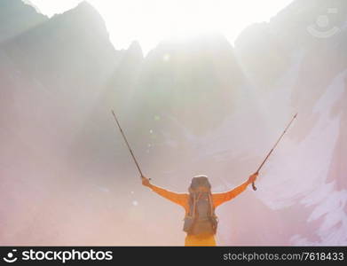 Backpacker in a hike in the summer mountains