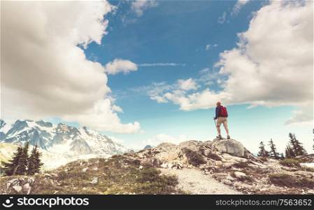 Backpacker in hike in the autumn mountains