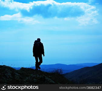 Backpacker in mountains