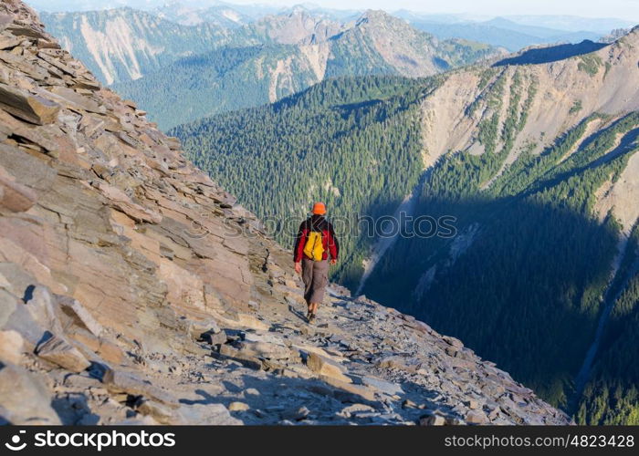 Backpacker in the summer mountains