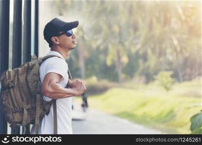 Backpacker man enjoy and relax with the nature. Travel Concept.